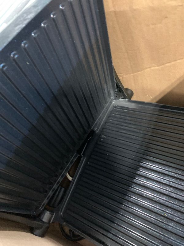 Photo 1 of ***BROKEN**** Chefman Panini Press Grill and Gourmet Sandwich Maker Non-Stick Coated Plates, Opens 180 Degrees to Fit Any Type or Size of Food, Stainless Steel Surface and Removable Drip Tray, 4 Slice, Black