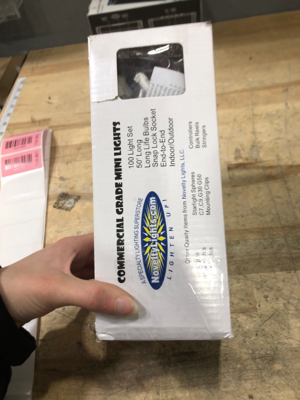 Photo 1 of ***white wiring with orange bulbs*** Novelty Lights 50 Feet 100 Bulbs Traditional Incandescent Mini Lights, Clear on Green Wire with 6" Spacing, Commercial Grade and UL Listed for Indoor/Outdoor Use, End-to-End Connectable