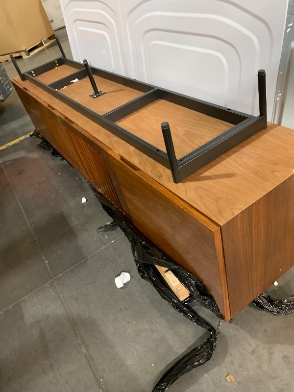 Photo 1 of ***DAMAGED, SEE PHOTOS***
***STOCK PHOTO FOR REFERENCE ONLY***
***TRUCK/TRAILER PICKUP ONLY***
79" WOOD TV STAND 