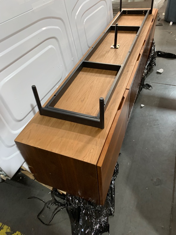Photo 1 of ***DAMAGED, SEE PHOTOS***
***STOCK PHOTO FOR REFERENCE ONLY***
***TRUCK/TRAILER PICKUP ONLY***
79" WOOD TV STAND 