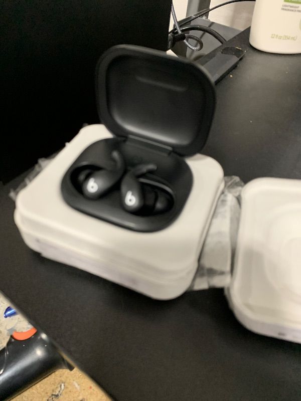 Photo 1 of right earbud nonfunctional --------------------------------Beats Powerbeats Fit - Wireless Noise Cancelling Workout Earbuds with Secure-Fit Wingtips, Up to 30-Hour Battery Life, Sweat & Water Resistant, Apple & Android Compatible - Jet Black