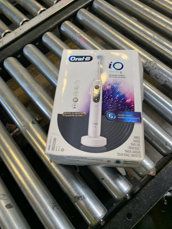 Photo 1 of Oral-B iO Series 8 Electric Toothbrush with 2 Replacement Brush Heads and Travel Case, Rechargeable Toothbrush, Whitealabaster