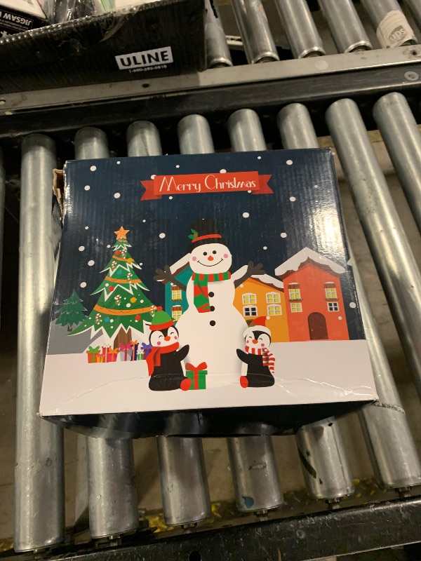 Photo 1 of OurWarm 6ft Christmas Inflatables Christmas Decorations Outdoor, Inflatable Snowman Penguin Blow Up Yard Decorations with Rotating LED Lights for Indoor Outdoor Christmas Decorations Yard Garden Decor
