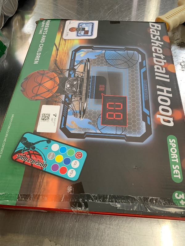 Photo 1 of VROGTIK Indoor Basketball Hoop for Kids with Led Lights Mini Basketball Hoop with Remote Control Over The Door Basketball Hoops with Scoreboard Basketball Toys for 4-12 Year Old Boys Girls