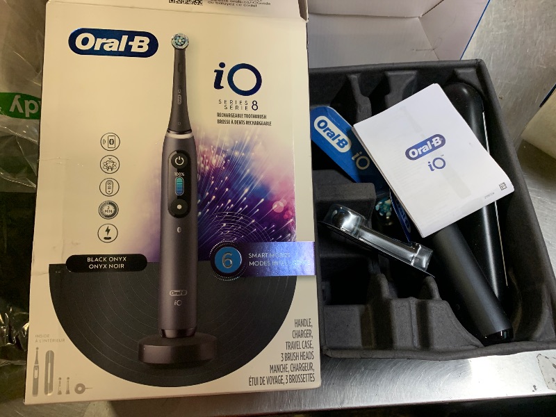 Photo 1 of Oral-B iO Series 8 Electric Toothbrush with 2 Replacement Brush Heads and Travel Case, Rechargeable Toothbrush, Black Onyx