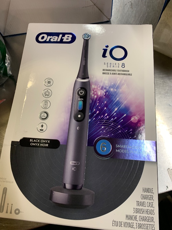Photo 1 of Oral-B iO Series 8 Electric Toothbrush with 2 Replacement Brush Heads and Travel Case, Rechargeable Toothbrush, Black Onyx