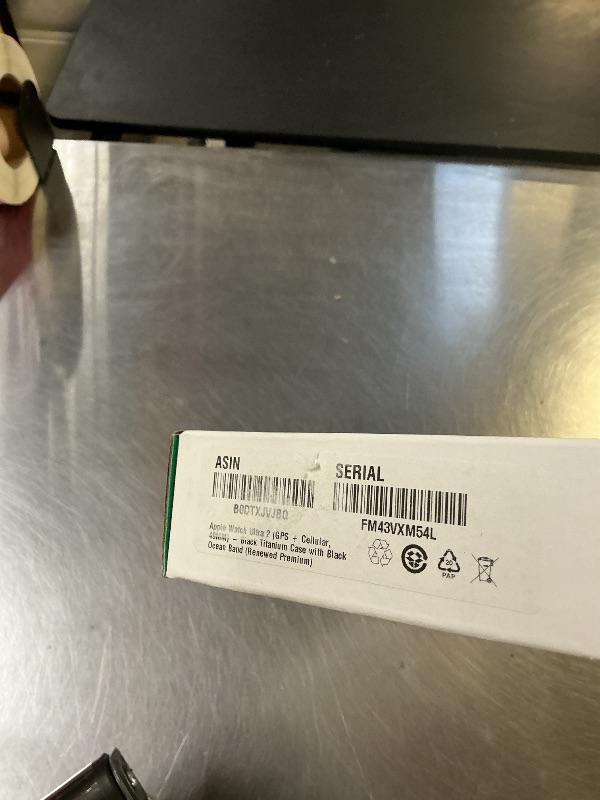 Photo 1 of Apple Watch Ultra 2 (GPS + Cellular, 49MM) - Black Titanium Case with Black Ocean Band (Renewed Premium)