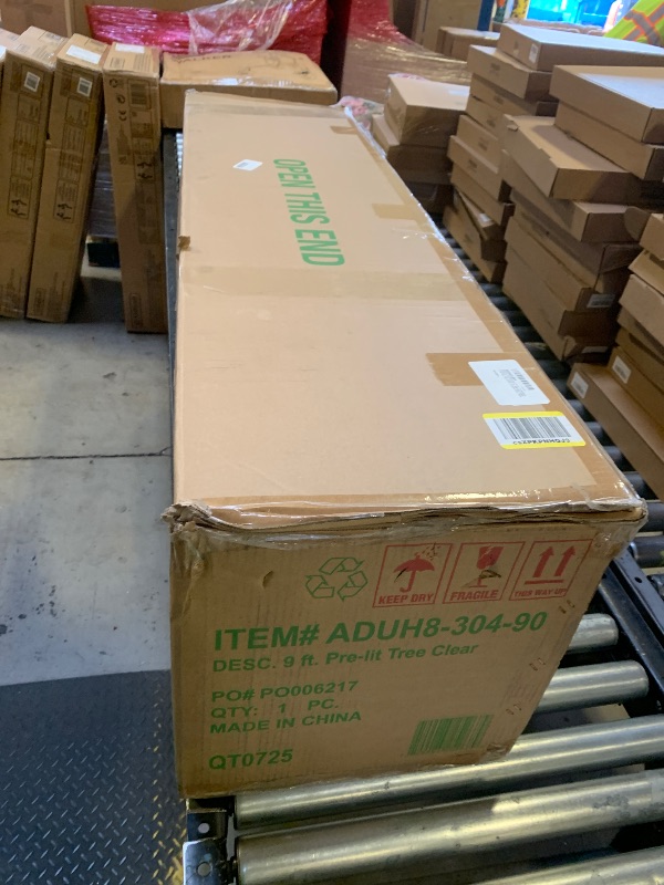 Photo 1 of National Tree Company 9 ft Pre-lit Artificial Christmas Tree, Dunhill Fir, 800 Clear Lights, 2,100 Tips, Slim Profile, Includes Stand, Green