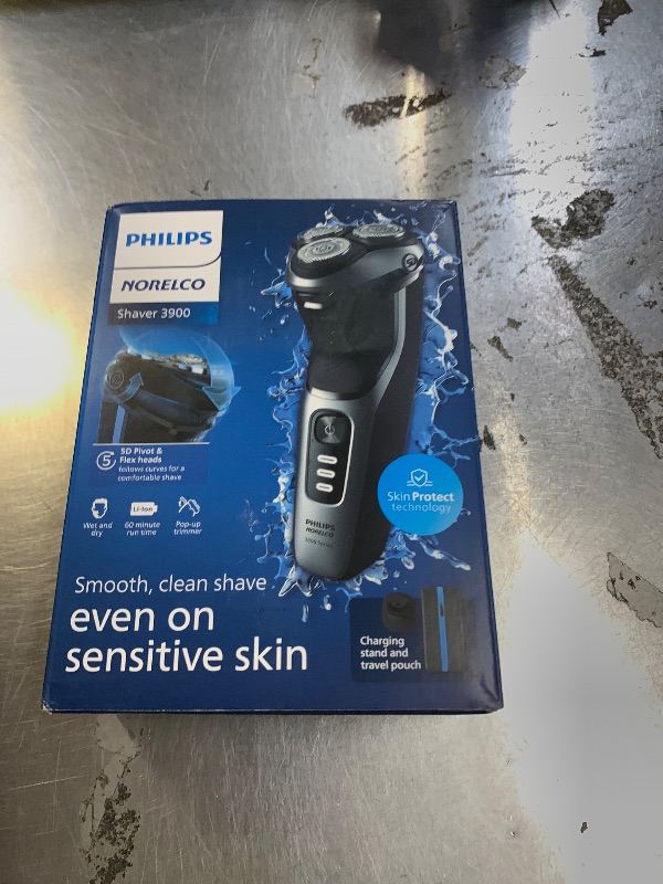 Photo 1 of SELLING FOR PARTS ONLY ........Philips Norelco Shaver 3900 Series, Wet and Dry Electric Shaver, P-Cap, Travel Pouch, Charging Stand, Storm Blue, Model S3341/92