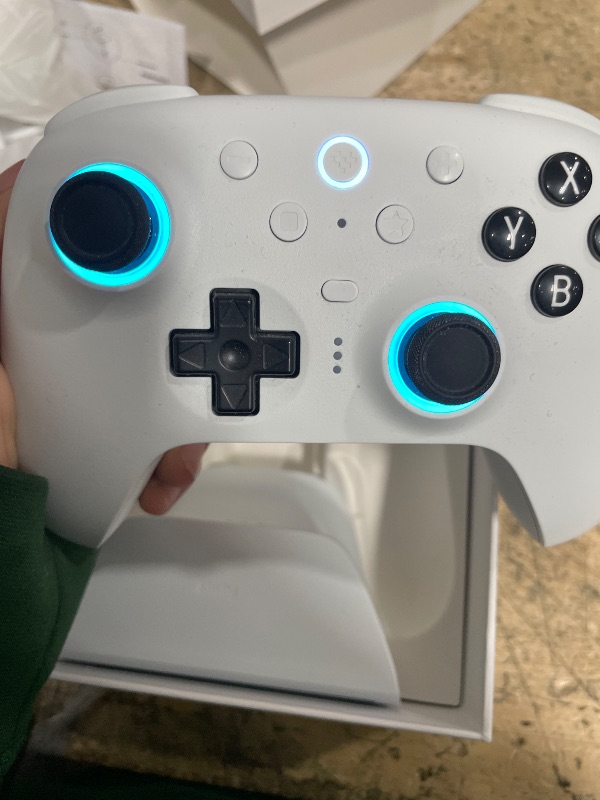 Photo 1 of ***POSSIBLY FOR PARTS/ MALFUNCTIONS DURING USE*** 8Bitdo Ultimate 2 Bluetooth Controller with TMR Joysticks, Switchable Hall Effect/Tactile Triggers, Vibration, Motion Control, RGB Fire Ring and Back Buttons for Switch/Switch 2 & Windows PC - White