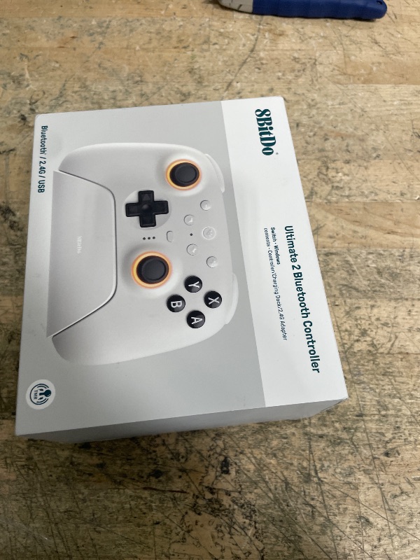Photo 1 of ***POSSIBLY FOR PARTS/ MALFUNCTIONS DURING USE*** 8Bitdo Ultimate 2 Bluetooth Controller with TMR Joysticks, Switchable Hall Effect/Tactile Triggers, Vibration, Motion Control, RGB Fire Ring and Back Buttons for Switch/Switch 2 & Windows PC - White