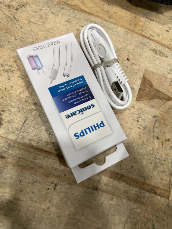 Photo 1 of **partial set, missing the tooth brush and the case and charger 
Philips Sonicare Compact Flosser 1000, Blue, ProtectiveClean 5300 Rechargeable Electric Toothbrush and 2PK Compact Nozzle Bundle