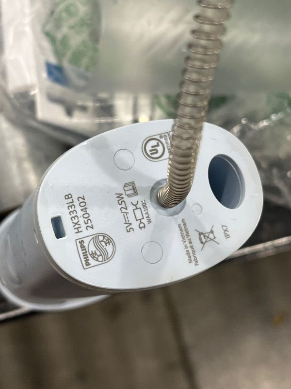 Photo 1 of **partial set, missing the tooth brush and the case and charger 
Philips Sonicare Compact Flosser 1000, Blue, ProtectiveClean 5300 Rechargeable Electric Toothbrush and 2PK Compact Nozzle Bundle