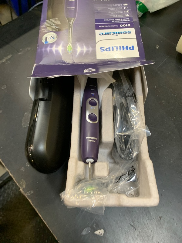 Photo 1 of Philips Sonicare ProtectiveClean 6100 Rechargeable Electric Toothbrush, with Pressure Sensor, 3 Cleaning Modes, SmarTimer and QuadPacer, 14-Day Battery Life, Travel Case, Deep Purple, Model HX6471/03