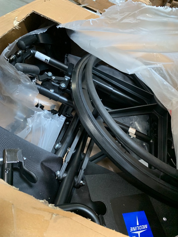 Photo 1 of ** USED**Medline Premium Ultra-Lightweight Wheelchair with Flip-Back Desk Arms and Elevating Leg Rests for Extra Comfort, Black, 22” x 18" Seat
