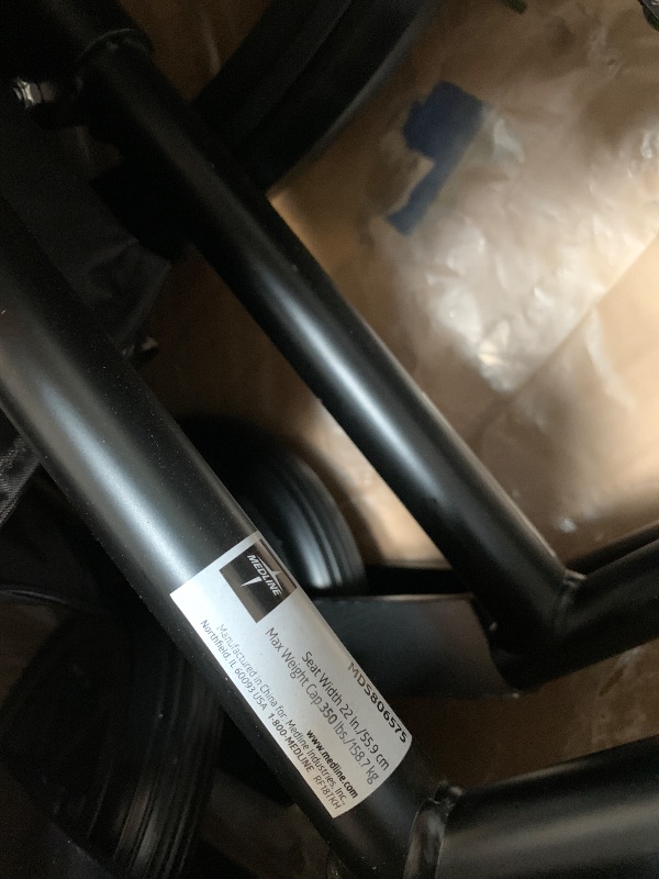 Photo 1 of ** USED**Medline Premium Ultra-Lightweight Wheelchair with Flip-Back Desk Arms and Elevating Leg Rests for Extra Comfort, Black, 22” x 18" Seat