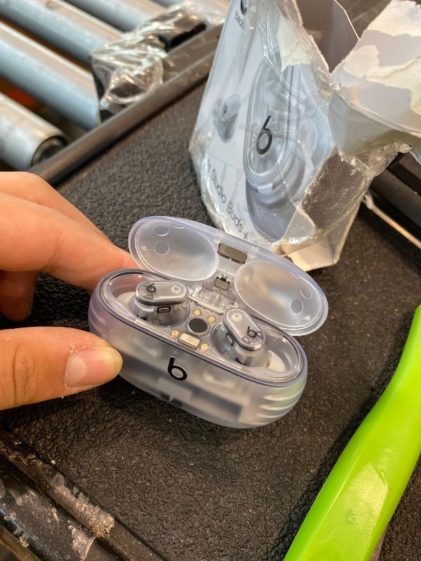 Photo 1 of [LEFT EARBUD IS NONFUNCTIONAL] Beats Studio Buds + | True Wireless Noise Cancelling Earbuds, Enhanced Apple & Android Compatibility, Built-in Microphone, Sweat Resistant Bluetooth Headphones, Spatial Audio - Transparent