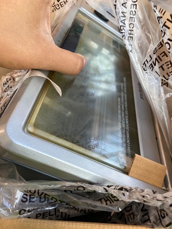 Photo 1 of **UNTESTED**
Proctor Silex 4 Slice Countertop Toaster Oven, Multi-Function with Bake, Toast and Broiler, 1100 Watts, 30 min timer and auto-shutoff, Includes Backing Pan and Rack, Black and Silver (31260)