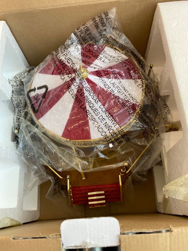 Photo 1 of **MAJOR DAMAGE**
Mr. Christmas Gold Label Animated and Musical Carousel, Christmas Decoration, LED Lights, Plays 50 Songs, 8 Inch, Red