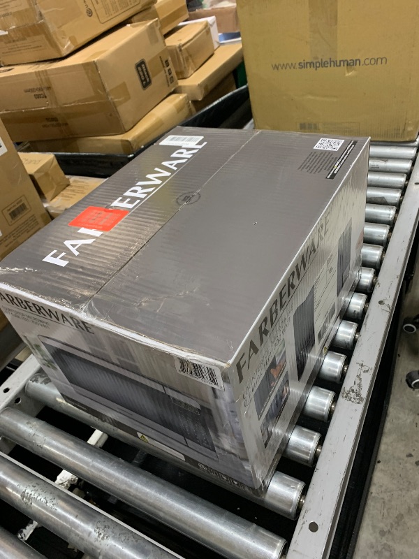 Photo 1 of Farberware 0.7 Cu. Ft. Countertop Microwave Oven – 700 Watts Power, Auto Cook Settings, Defrost, Easy Clean and Child Safety Lock - Stainless and Black