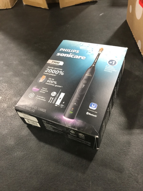 Photo 1 of Philips Sonicare 7300 Series Electric Toothbrush - Next-Generation Sonicare Technology, Pressure Sensor, 12 Brushing Settings, SmarTimer, BrushPacer, 21-Day Runtime, Travel Case, Black, HX7421/07