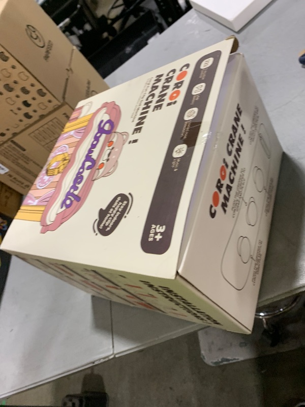 Photo 1 of Jovow Claw Machine for Kids, Mini Vending Machine with Music, Prize Dispenser Toys for Girls and Boys, Electronic Claw Game Machine for Party Birthdays, Includes 45 Mini Toys (Medium)