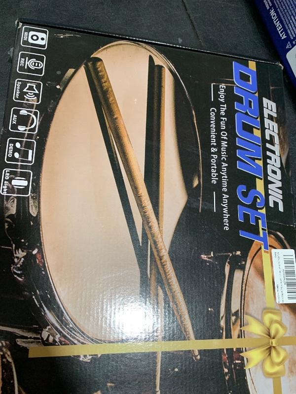 Photo 1 of Electric Drum Set with 7 Colorful LED Light Patterns, Enhanced Rebound Feel Electronic Drum Kit Featuring 9 Pads, Bluetooth MIDI, and Dual Speakers, Family Gift for Kids and Adult Beginners