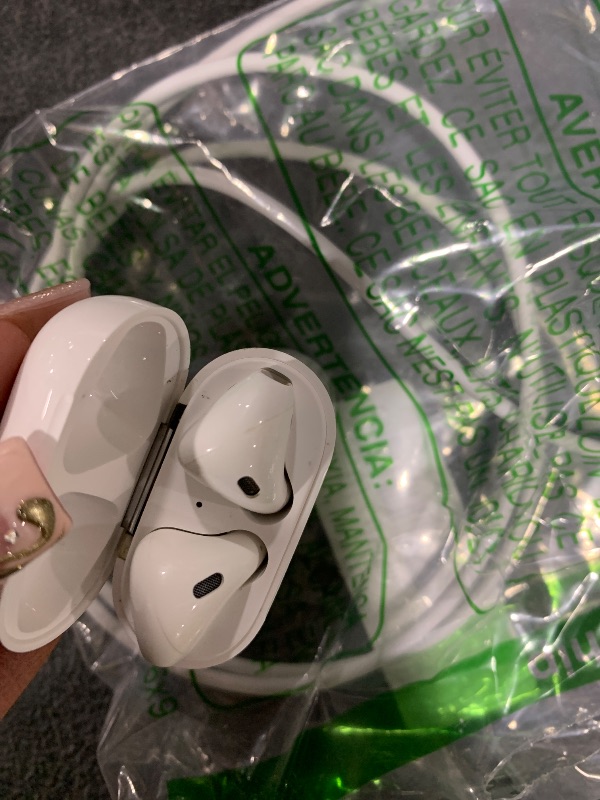 Photo 1 of Apple AirPods Wireless Ear Buds, Bluetooth Headphones with Lightning Charging Case Included, Over 24 Hours of Battery Life, Effortless Setup for iPhone