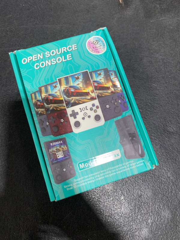 Photo 1 of R36MAX Handheld Game Console, Retro Gaming Console with 4000mAh Battery 4.0”IPS Screen, Open Source Linux System, with 64GB TF Card Portable Video Gaming Console, Transparent Ruby