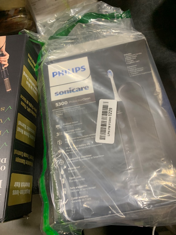 Photo 1 of Philips Sonicare ProtectiveClean 5300 Rechargeable Electric Toothbrush, with Pressure Sensor, 3 Cleaning Modes, SmarTimer and QuadPacer, with 2 Bonus Brush Heads, Travel Case, Black, Model HX6423/34
