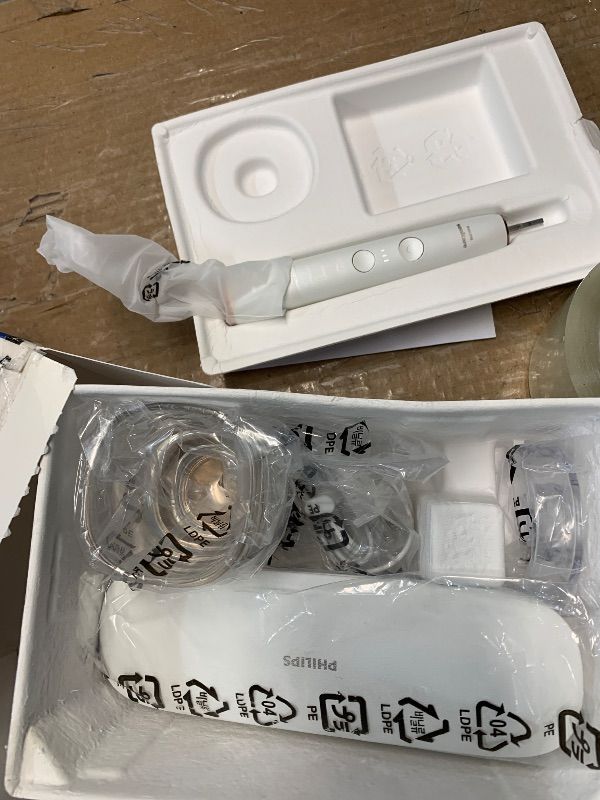 Photo 1 of ***MISSING PARTS***
***MINOR DAMAGE ***Philips Sonicare DiamondClean Smart 9500 Electric Toothbrush, Sonic Toothbrush with App, Pressure Sensor, Brush Head Detection, 5 Brushing Modes and 3 Intensity Levels, Rosegold, Model HX9923/61