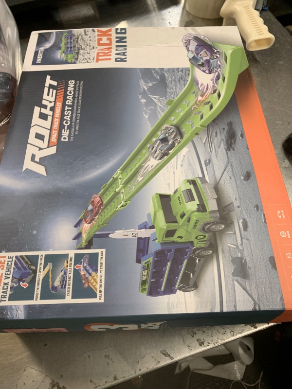 Photo 1 of Unimoly Carrier Truck Transport Toy, Foldable 2-Layer Car Race Track Playset with 25" Track & 6 Metal Cars, Birthday Gift for Boys Ages 3-8 (Green)