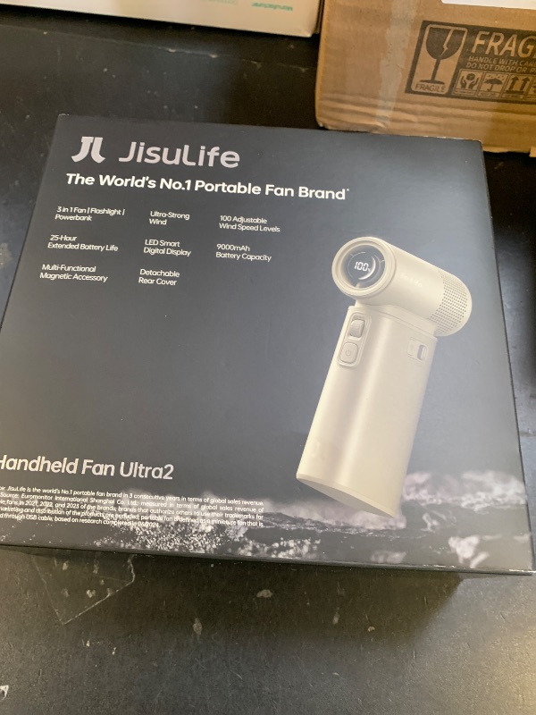 Photo 1 of JISULIFE Portable Handheld Fan Ultra2, 9000mAh Max 25 Hrs, 5 IN 1, 100 Speed Turbo Fan Rechargeable 18W Power Bank with Flashlight, Metal Shell Multi-Function Travel Essentials Gifts for Men-Brown