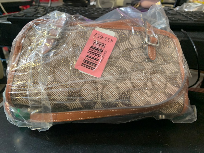 Photo 1 of COACH Swing Zip 20
