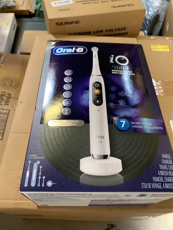 Photo 1 of Oral-B Rechargeable Electric Toothbrush, iO9 Genius, 7 Cleaning Modes, Interactive Display, Charging Travel Case, Visible Pressure Sensor, 4 Brush Heads, White Alabaster
