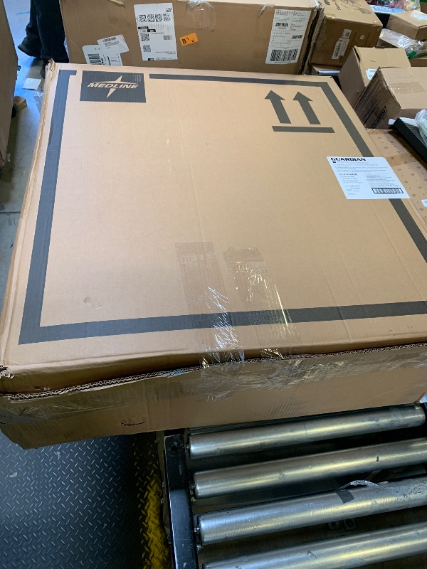 Photo 1 of Medline Comfortable Folding Wheelchair with Swing-Back, Desk-Length Arms and Elevating Footrests, 20”W x 16”D Seat