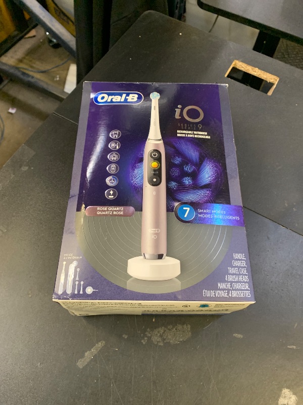 Photo 1 of Oral-B Rechargeable Electric Toothbrush, iO9 Genius, 7 Cleaning Modes, Interactive Display, Charging Travel Case, Visible Pressure Sensor, 4 Brush Heads, Rose Quartz