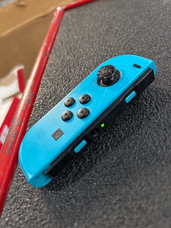 Photo 1 of (used)(incomplete) Nintendo Switch™ with Neon Blue and Neon Red Joy Con™