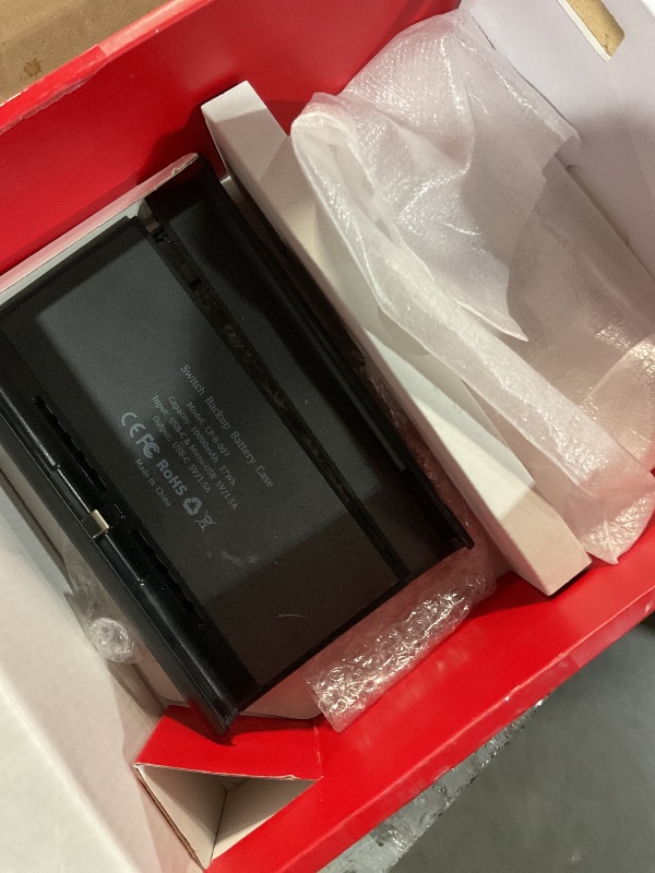 Photo 3 of (used)(incomplete) Nintendo Switch™ with Neon Blue and Neon Red Joy Con™