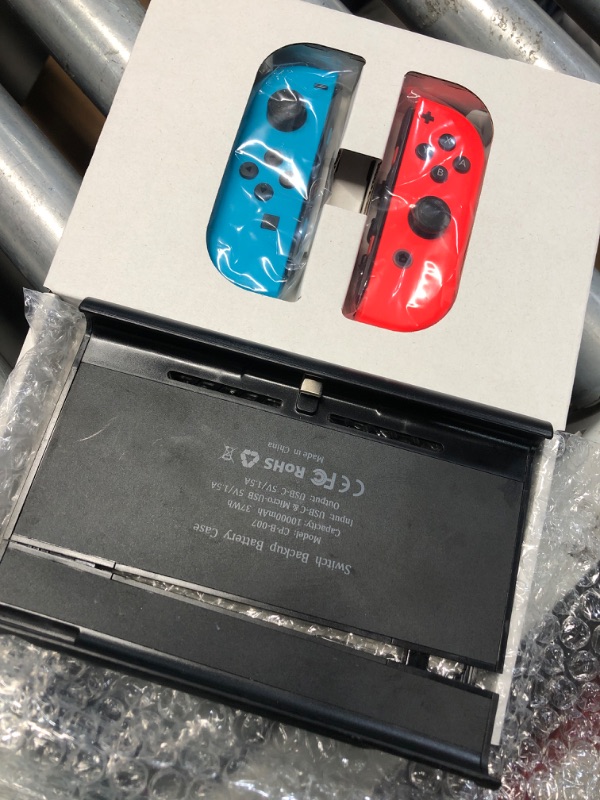 Photo 1 of (used)(incomplete) Nintendo Switch™ with Neon Blue and Neon Red Joy Con™