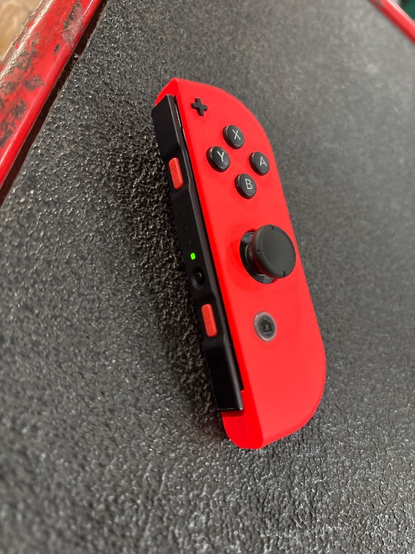Photo 1 of (used)(incomplete) Nintendo Switch™ with Neon Blue and Neon Red Joy Con™