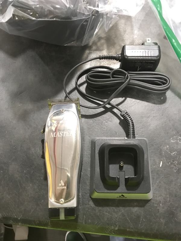 Photo 1 of Andis 12660 Professional Master Corded/Cordless Hair Clipper, Adjustable Carbon Steel Blade Hair Clipper for Close Cutting, Silver