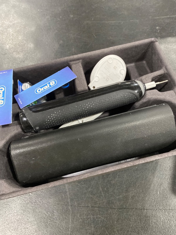 Photo 1 of Oral-B iO Series 9 Limited Rechargeable Black Electric Toothbrush with (2) Ultimate Clean and (1) Gentle Care Replacement Brush Heads, Black, Travel Case and Charger