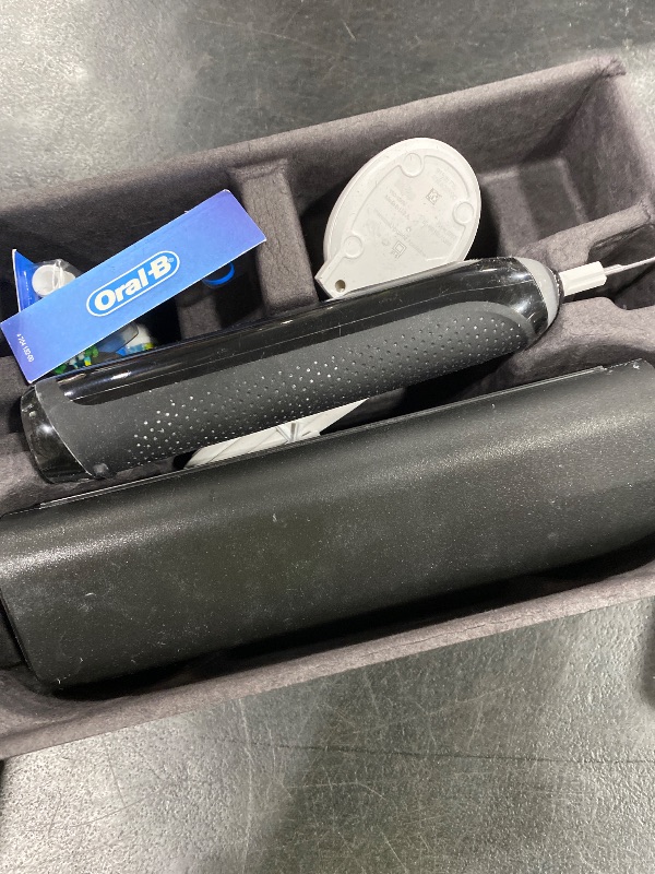 Photo 1 of Oral-B iO Series 9 Limited Rechargeable Black Electric Toothbrush with (2) Ultimate Clean and (1) Gentle Care Replacement Brush Heads, Black, Travel Case and Charger