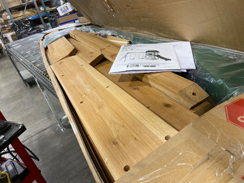 Photo 1 of Backyard Discovery Buckley Hill Cedar Wood Swing Set with Wave Slide, Play Deck, Rock Wall Ladder, Belt Swings, Chalkboard, Canopy Roof, Outdoor Playset