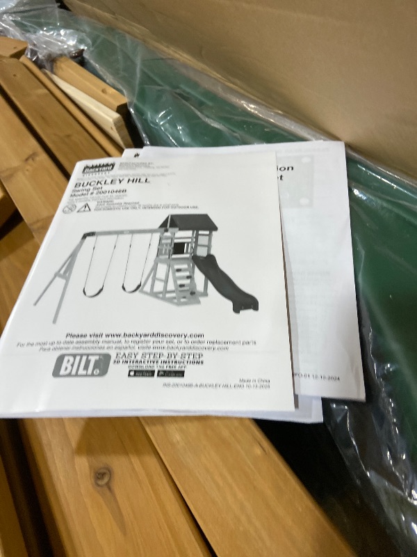 Photo 1 of Backyard Discovery Buckley Hill Cedar Wood Swing Set with Wave Slide, Play Deck, Rock Wall Ladder, Belt Swings, Chalkboard, Canopy Roof, Outdoor Playset