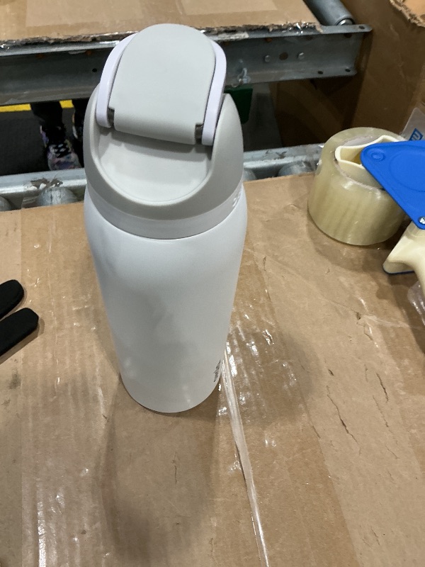 Photo 1 of ***MINOR DENTS*** Owala FreeSip Insulated Stainless Steel Water Bottle with Straw, BPA-Free Sports Water Bottle, Great for Travel, 40 Oz, Shy Marshmallow