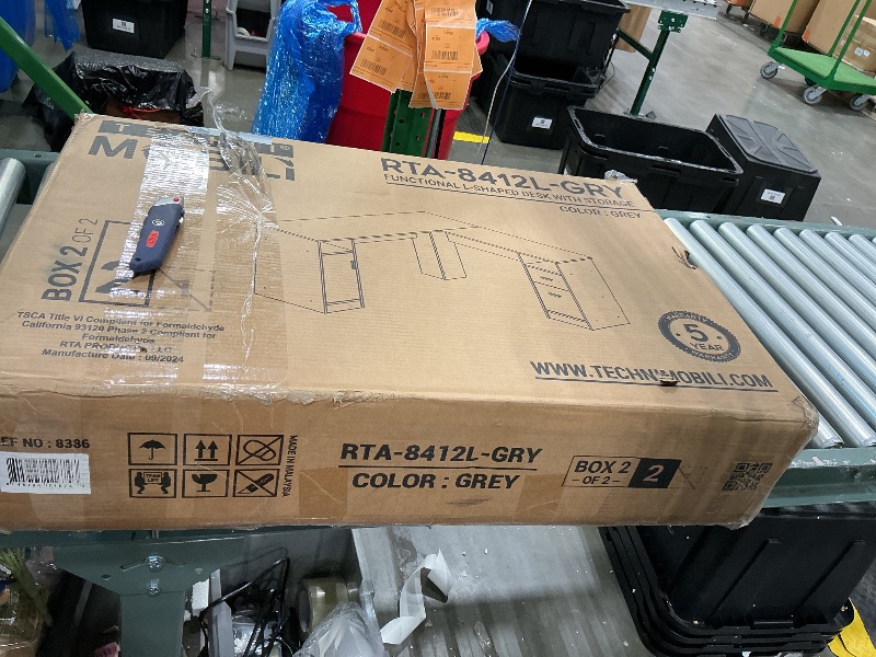 Photo 1 of *PARTIAL SET*
functional L shaped desk with storage gray box 2 of two