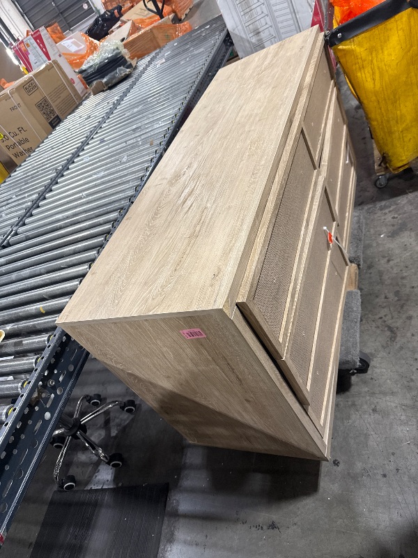 Photo 1 of ******MAJOR DAMAGE******Signature Design by Ashley Cielden Coastal 6-Drawer Dresser, Bronze-Tone Knobs, Safety Stop, Textured Cane Details, 62.01" W x 19.65" D x 35.67" H, Light Brown