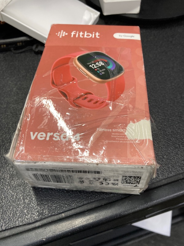 Photo 1 of ***DOES NOT POWER ON***Fitbit Versa 4 Fitness Smartwatch with Daily Readiness, GPS, 24/7 Heart Rate, 40+ Exercise Modes, Sleep Tracking and more, Pink Sand/Copper Rose, One Size (S & L Bands Included)***DOES NOT POWER ON***